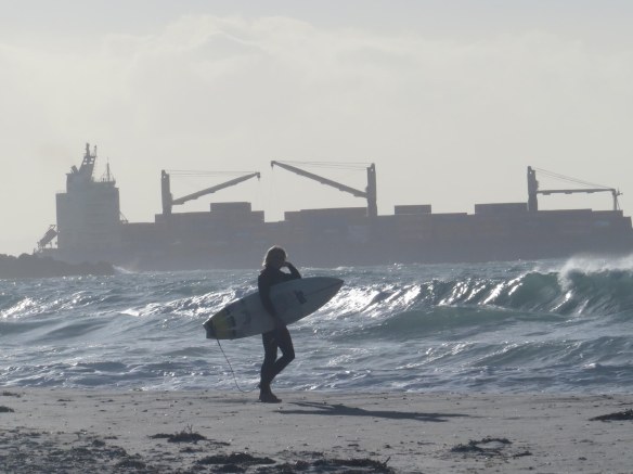Surfer and container ship